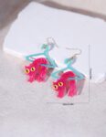 Material: transparent plastic “polymethyl methacrylate” Models Type: Shiny pink cat hanging on a clothes hanger